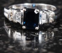 A 9ct gold sapphire and diamond ring. 33pts. Measures:3.6g size M.