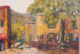 A 20th century oil on canvas painting of a Spanish villa market town scene. Framed. 33cm H 31.