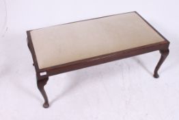 A large oak window seat box having padded seat being raised on cabriole legs.