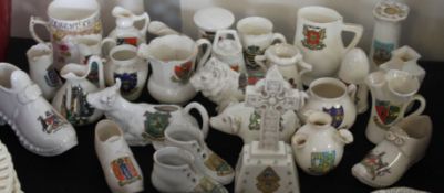 A large collection of assorted crested china to include Goss, Arcadian and many others.