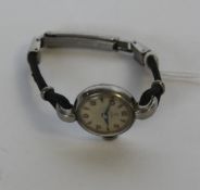 A vintage ladies Rolex tudor cocktail dress watch set over leather strap.