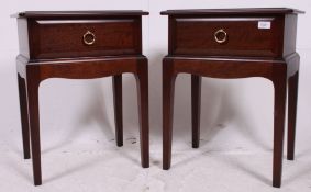 A pair of Stag mahogany ' Minstrel ' bedside tables.