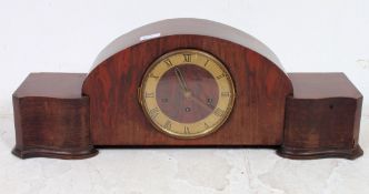 An early 20th century large oak cased mahogany mantel clock having Westminster chime movement