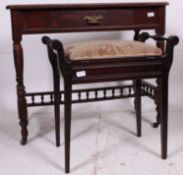 A Victorian mahogany writing table raised on tapered supports together with a piano stool having