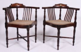 A pair of late Victorian / Edwardian mahogany inlaid marquetry corner chairs raised on turned legs