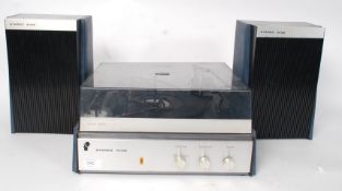 A vintage record player together with a large quantity of records