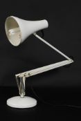 A vintage Herbert Terry anglepoise Industrial lamp raised on terraced base with pendant shade