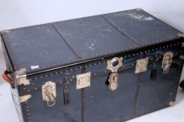 A good 20th century large blue and metal clasp steamer trunk of large proportions with hinged top