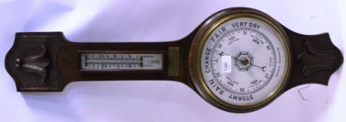 A 1930's Oak Aneroid banjo barometer having original brass notation plaque dating to the 1930's