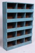 An early 20th century painted shabby chic stationary / cubby cabinet having painted blue finish.