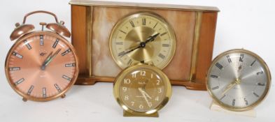A collection of 4x vintage clocks to include two Smiths,