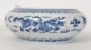 A Chinese Kang Xi blue and white Brush washing pot Dragon bathing at the bottom of the pond,