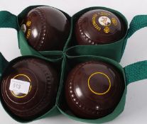 A set of Greenmaster Bowls, within a green carrycase.