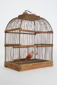 A vintage 19th century wooden and wirework bird cage having hook atop