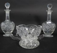 2 good quality glass decanters complete with stoppers together with a fruit bowl and sweet jar