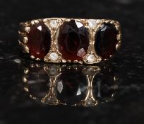 A 9ct gold and ruby garnet and believed diamond garnet ring. Measures: 4.1g size V.