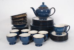 A collection of Denby china to include dinner plates, side plates,  cups,