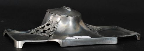 An early 20th cenutry WMF Jugendstil silver plated desk / pen stand with a central inkwell on an