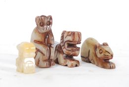 A collection of 4x 20th century carved Chinese / oriental jade animals / figures to include Lion,