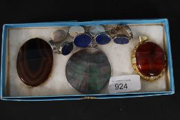 A Lapis Lazuli bracelet mounted on silver along with three polished stone pendants