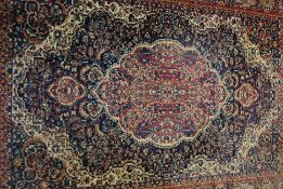 A vintage style Belgian Kelim rug with blue ground together with another larger Turkish style rug