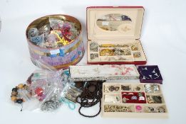 A large assortment of costume jewellery to include brooches, necklaces,