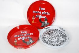 A collection of new and unused pub metal trays,