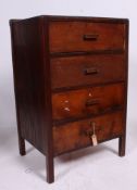 A 1930's Heals style oak upright chest / bank of drawers being raised on squared legs with drawers