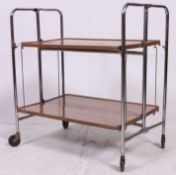 A metamorphic retro chrome and faux wood folding trolley on castors dating to the 1970's.