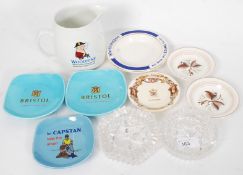A collection of smoking related collectables to include dishes and other items by Bristol, Woodbine,
