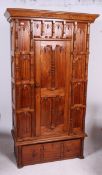 A 20th century Asiatic hardwood sing wardrobe having plinth base and drawer with upright body