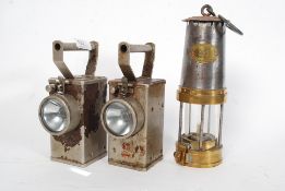 An early 20th century brass miners lamp, stamped GPO, with plaque to top.