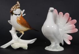 A Karl Ens style china crested bird figurine, along with another figurine of a dove.
