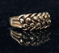 A 9ct gold Celtic style ring, with twist pattern to shoulders. Weight 4.9g size S.