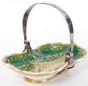 A  Georgian 19th century silver and porcelain miniature trug basket having green ground with gilt