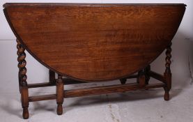 A very good quality Ipswitch oak barley twist drop leaf dining table.