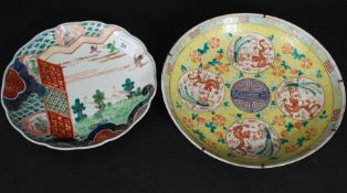 A Cantonese famille rose decorated plate stylised with scenes of storks bearing character marks to