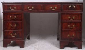 A Georgian style mahogany twin pedestal office desk.