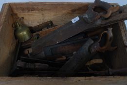 A collection of vintage woodworking tools to include mitre saws,