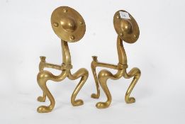 A pair of Victorian Arts & Crafts brass fire dogs / andirons having shaped supports with roundels