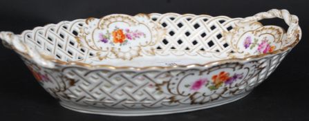 A 20th century Meissen ribbon bowl with fret pierced surround having floral spray to centre.