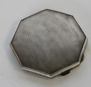 A silver hallmarked octagonal ladies compact by Crisford & Norris bearing Birmingham hallmarks for
