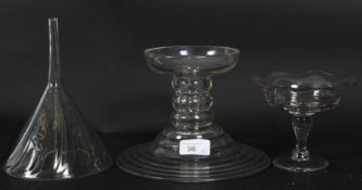 A 19th century Georgian large glass funnel together with a glass butchers ham stand along with a