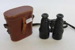 A pair of War Office Model Binoculars in the original leather case stamped War office model by