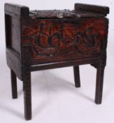 An antique style carved hardwood armada style chest raised on squared legs with carved detailing to
