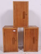A collection of 3 oak 1970's school microscope cabinets each with  hinged doors having lined