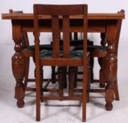 A 1930's Art Deco oak draw leaf oak dining table raised on cup and cover legs together with a set