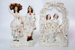 Two 19th century Staffordshire flatback figurines of couples.