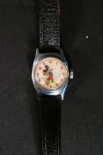A vintage / retro Micky Mouse wrist watch with Micky to face and his arms and gloves acting as