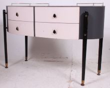 A 1970's retro unusual lozenge shaped dressing table / chest of drawers having painted finish with